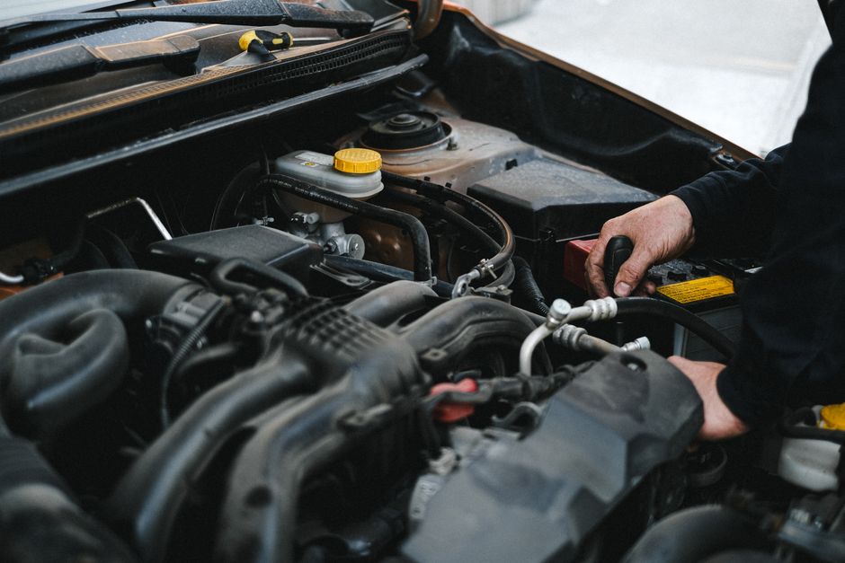 Mechanic holding car keys after successful service
